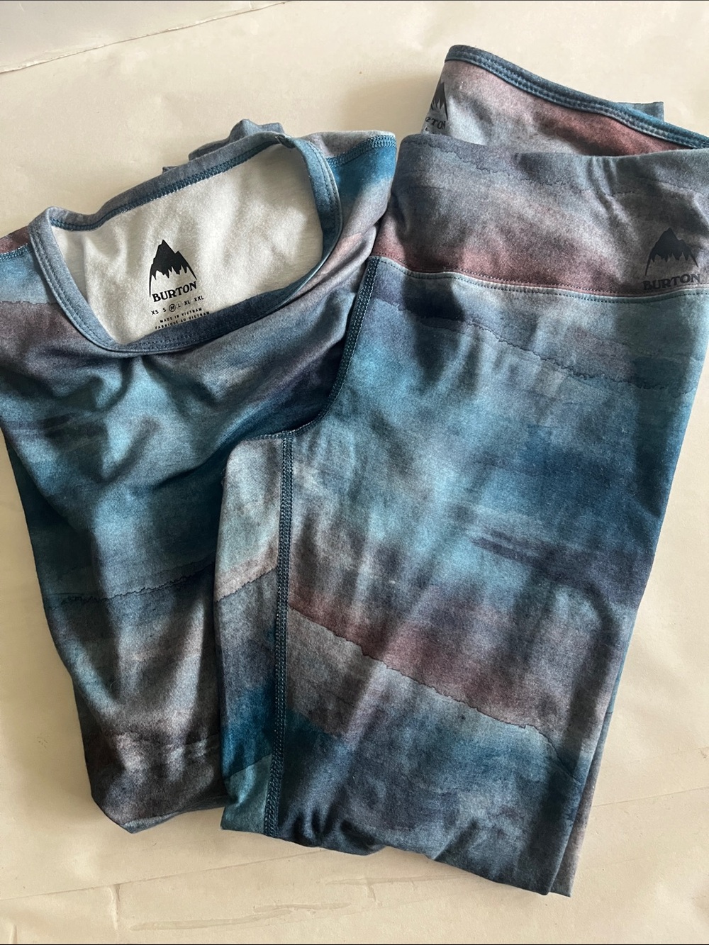 Burton women's midweight thermal base layer set featuring a blue & purple water
